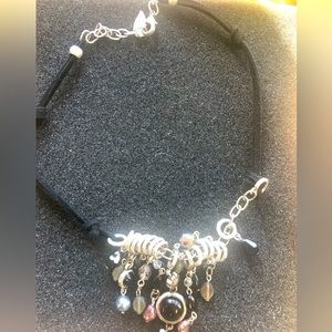 Fashion beaded necklace on black suede cord . Great accent piece